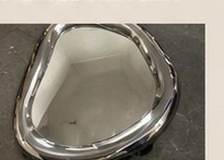 Mirror shaped from raw stainless steel