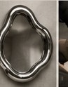 Steel being shaped into the mirror form